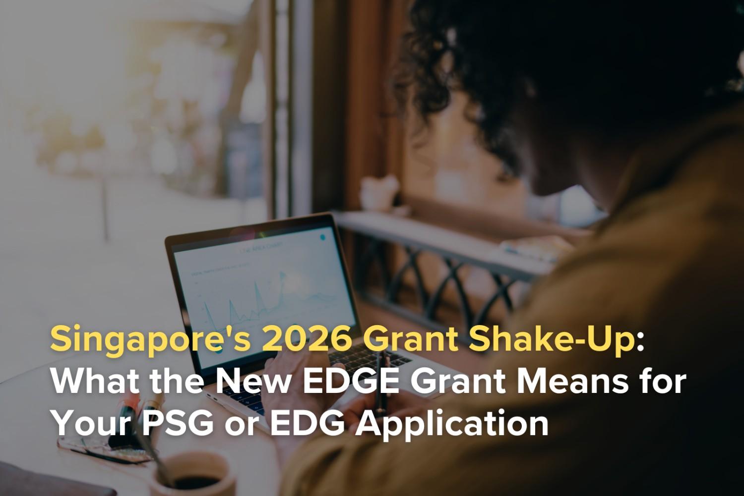 Singapore business owner using a laptop with the headline about the new EDGE grant and changes affecting PSG and EDG applications.